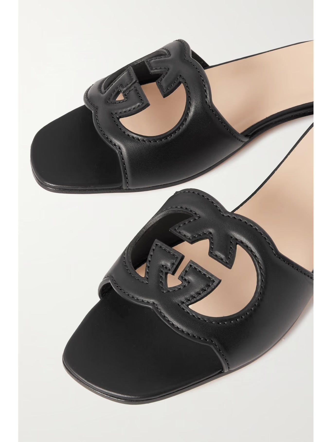 GUCCI
Cutout leather slides