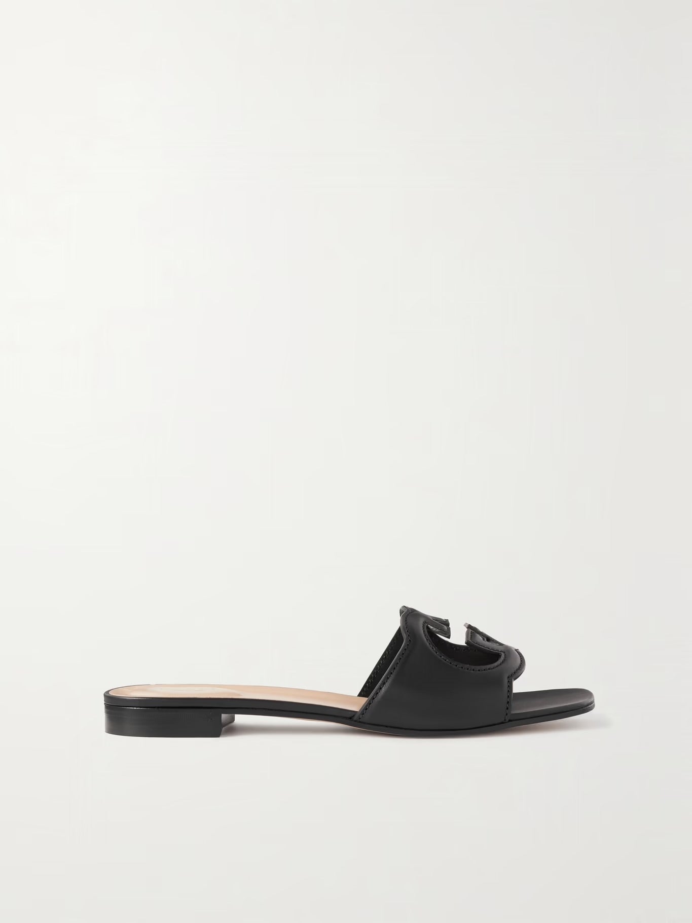 GUCCI
Cutout leather slides