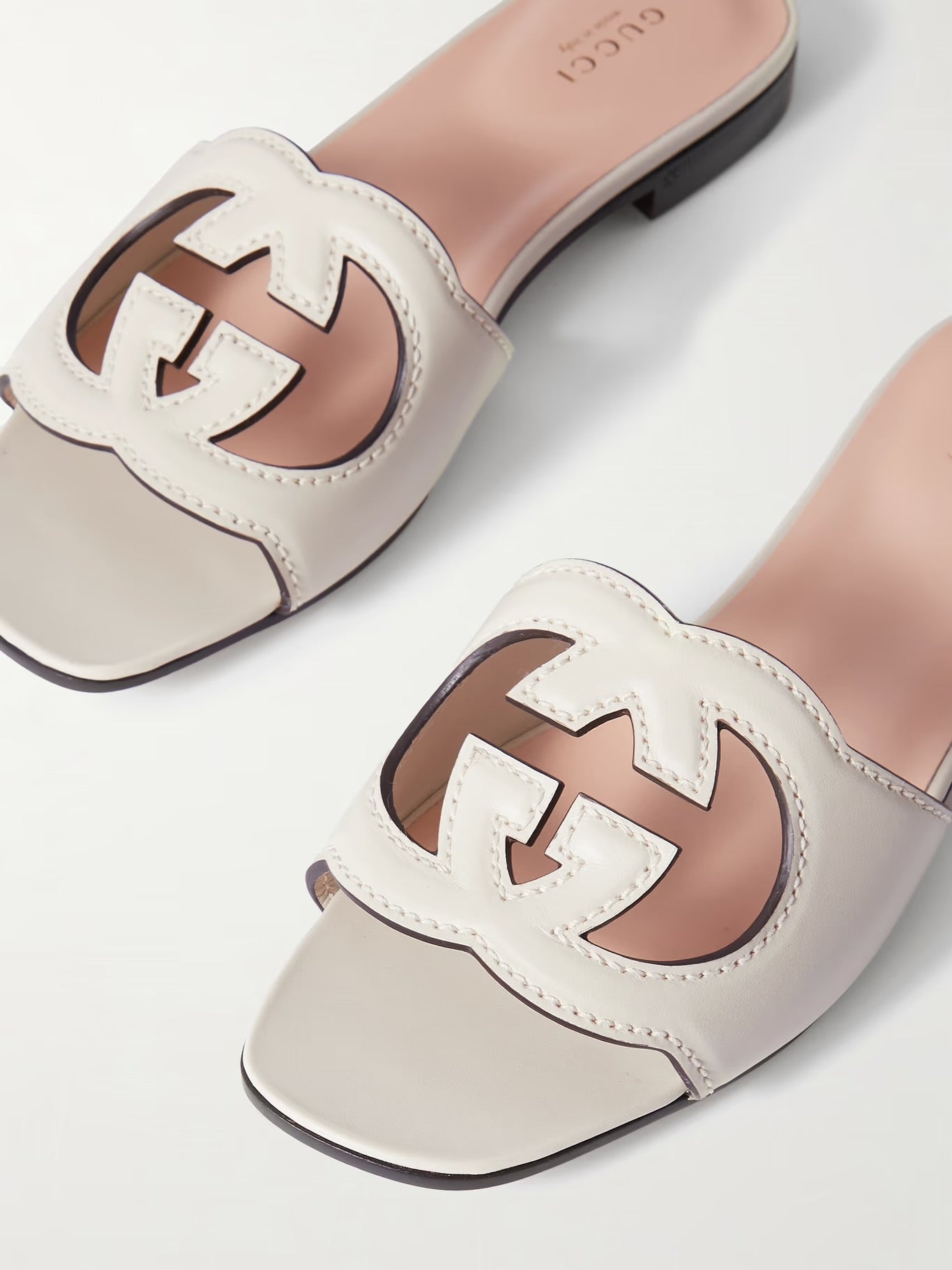 GUCCI
Cutout leather slides White